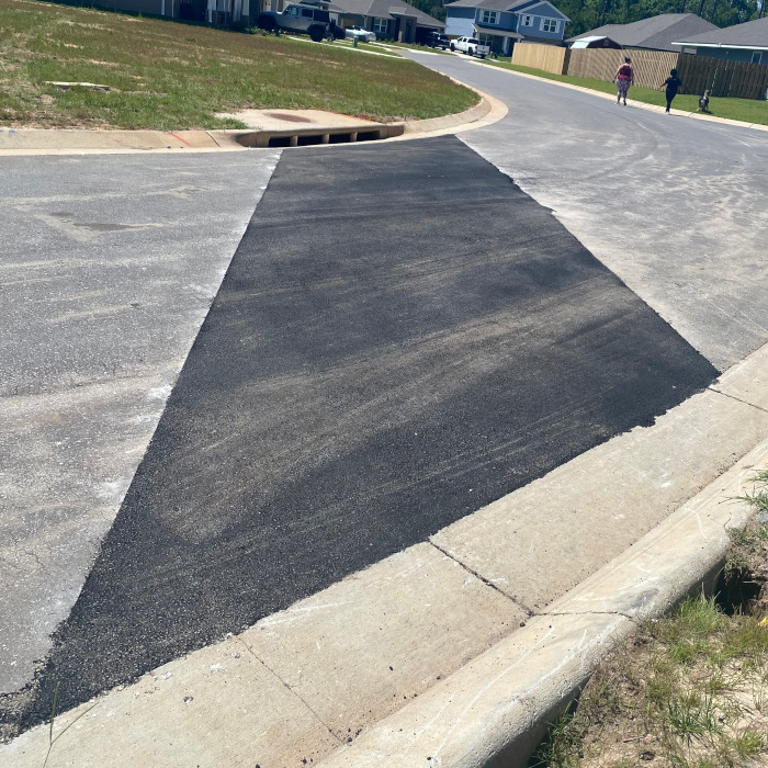 chavers construction asphalt patching in residential neighborhood